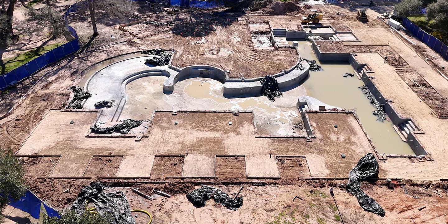 Aerial view of a pool under construction at The Clubs at Houston Oaks