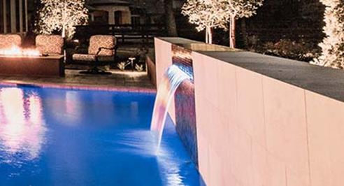 Sheer descent and scuppers spilling into a pool