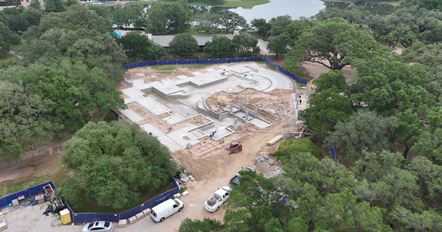 Aerial view of a luxury home and pool site